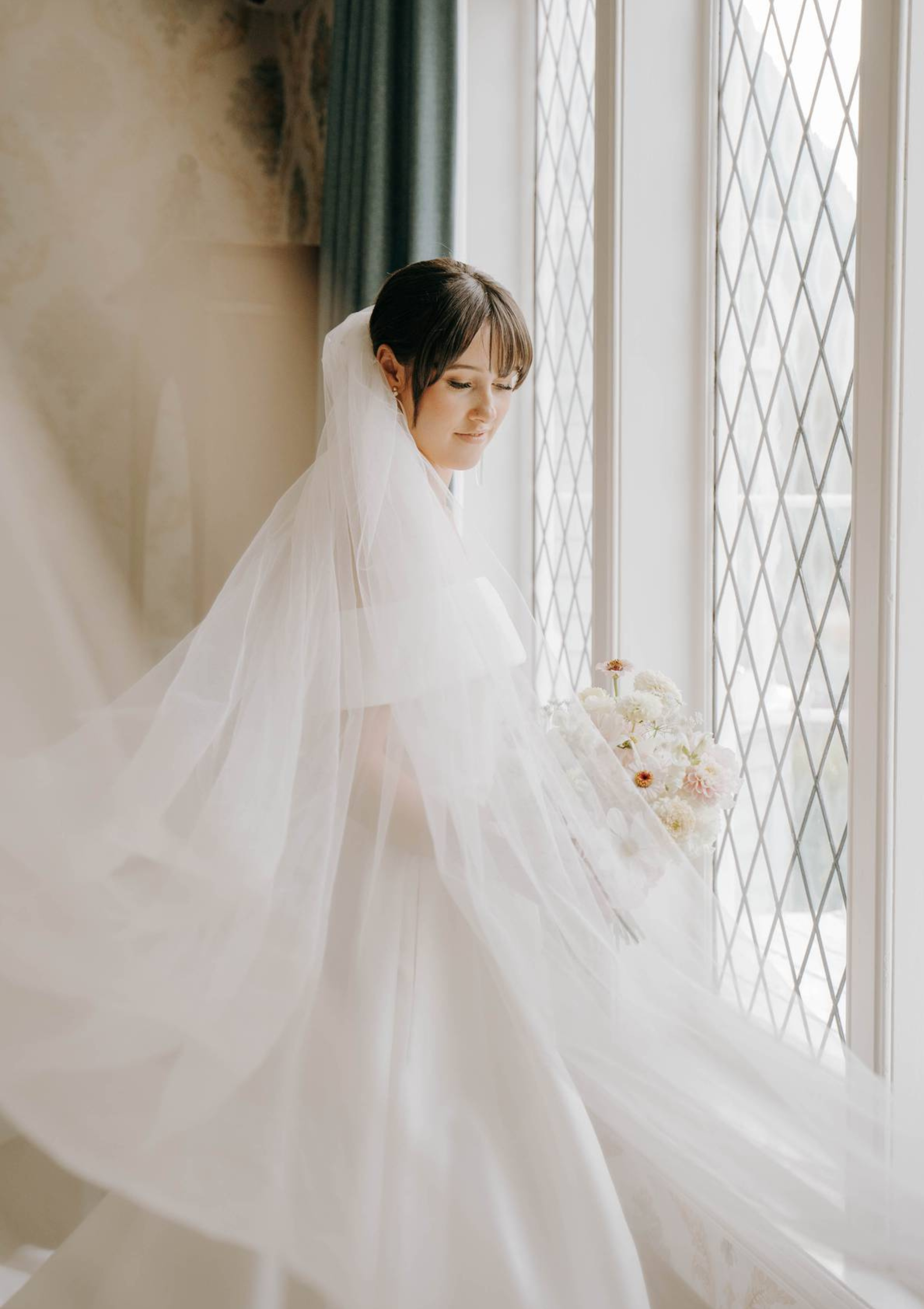 Floaty cathedral length bridal veil from behind, minimalist wedding style